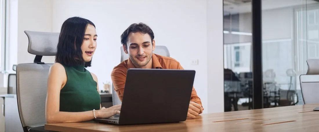 Two colleagues reviewing loan information together